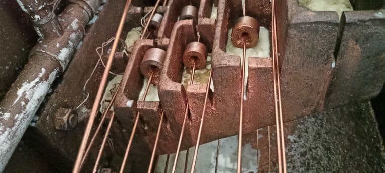 Copper wire passing through drawing equipment at Elite Cables